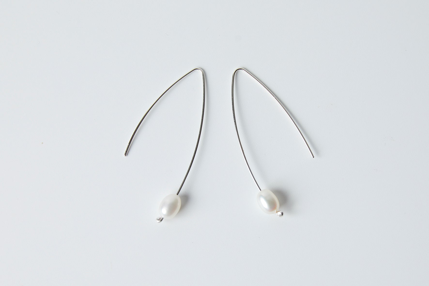 Long pearl earrings